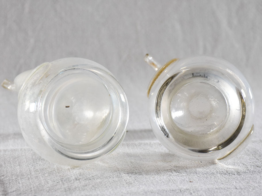 Two eighteenth-century blown glass oil pitchers