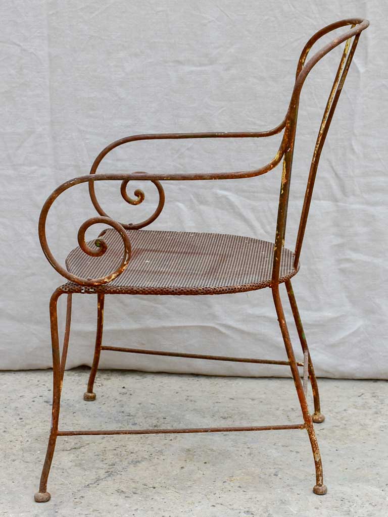Antique French garden armchair with bar backrest and perforated seat