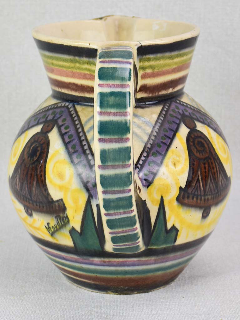 Mid-century Quimper pitcher decorated with bells and trees
