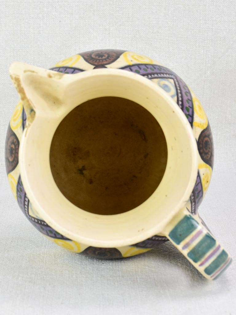 Mid-century Quimper pitcher decorated with bells and trees