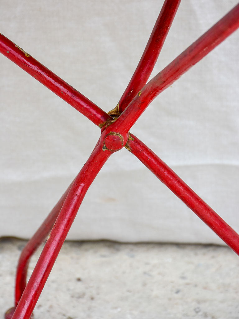 Folding antique French garden table with yellow table top and red legs