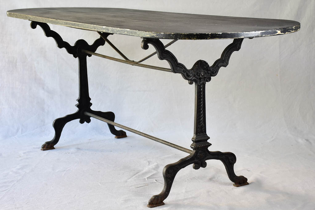 Vintage French oval table with cast-iron base 70¾" x 26¾"