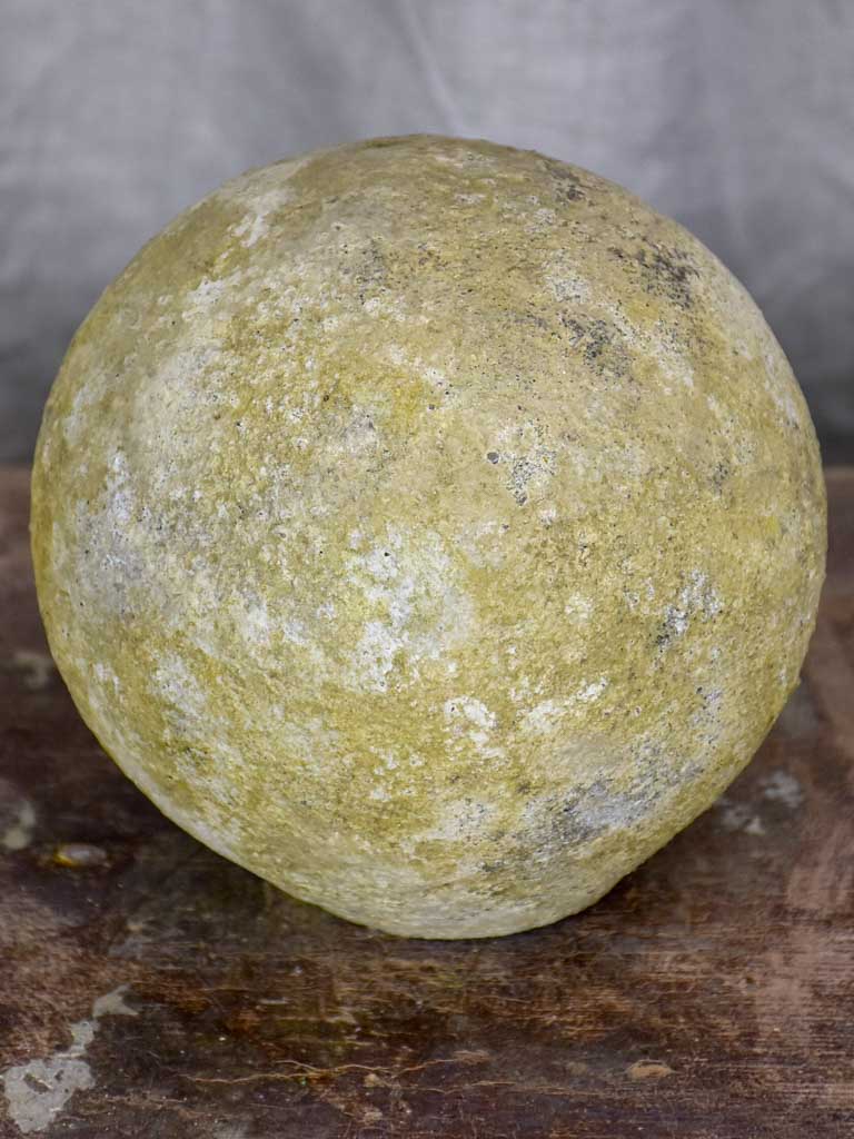 Round antique stone garden accent