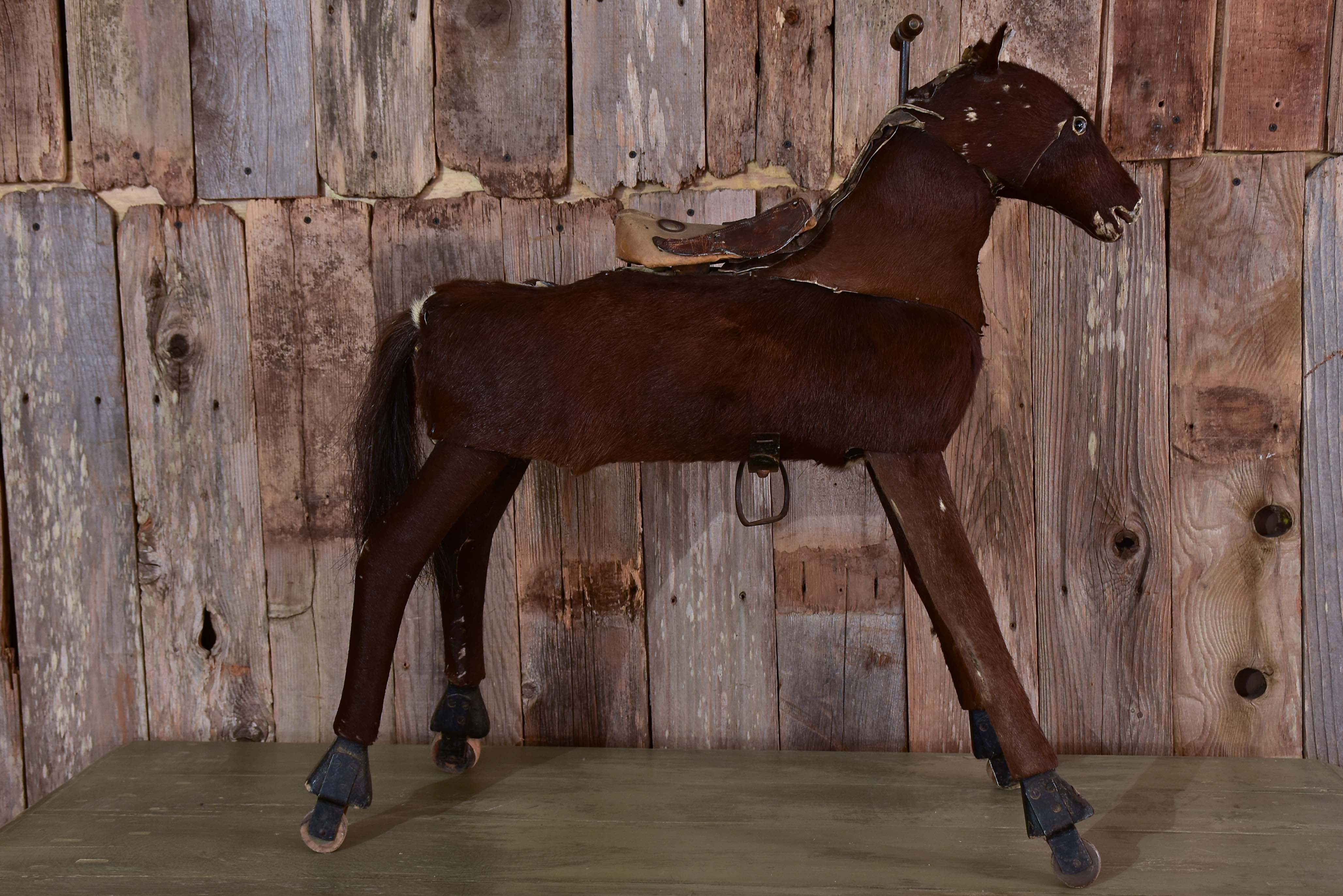 Antique French toy horse with moving mechanism