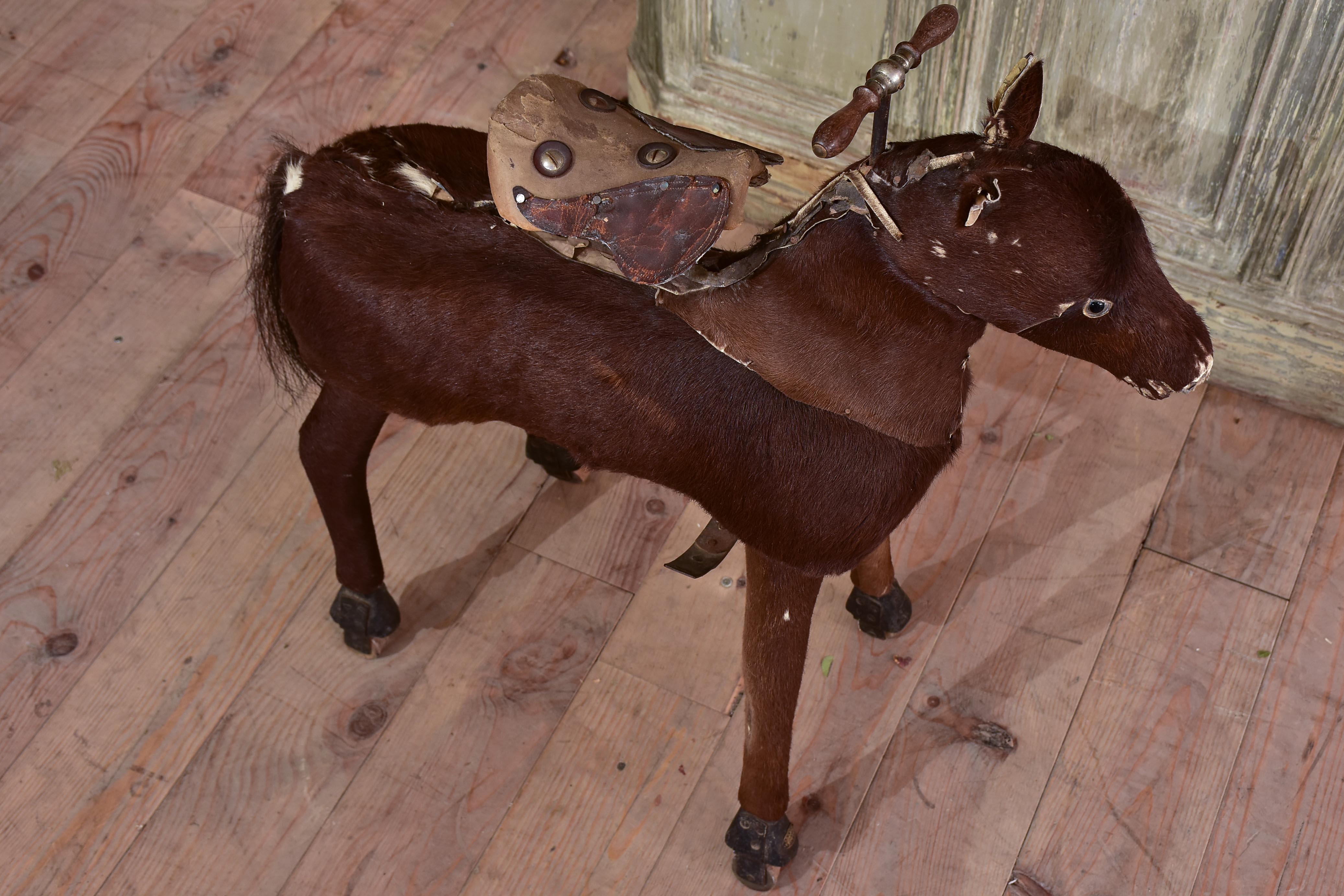 Antique French toy horse with moving mechanism