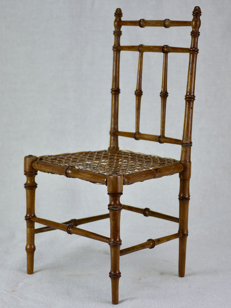 Miniature antique French chair with bamboo frame and cane seat