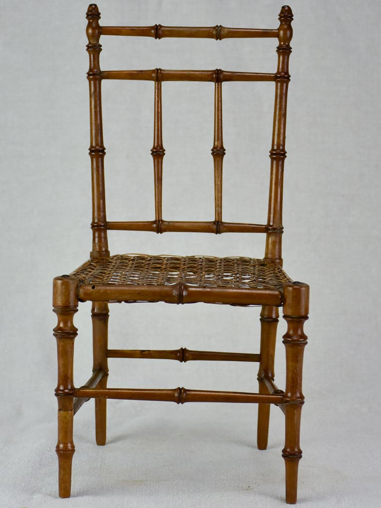 Miniature antique French chair with bamboo frame and cane seat