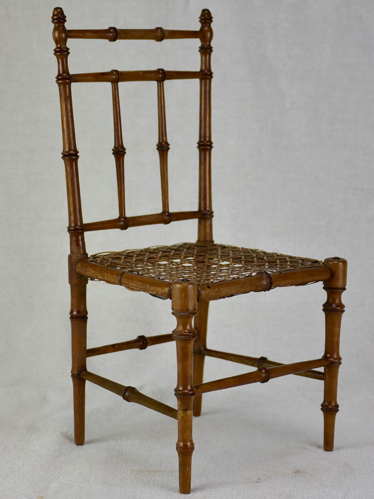 Miniature antique French chair with bamboo frame and cane seat