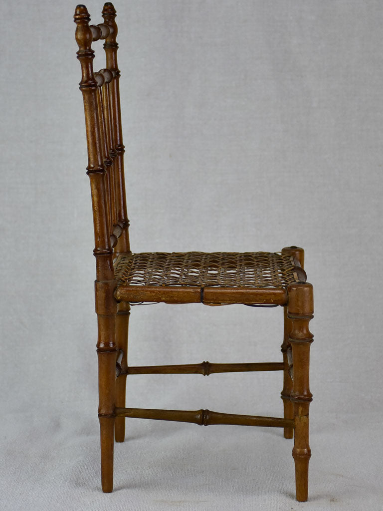 Miniature antique French chair with bamboo frame and cane seat