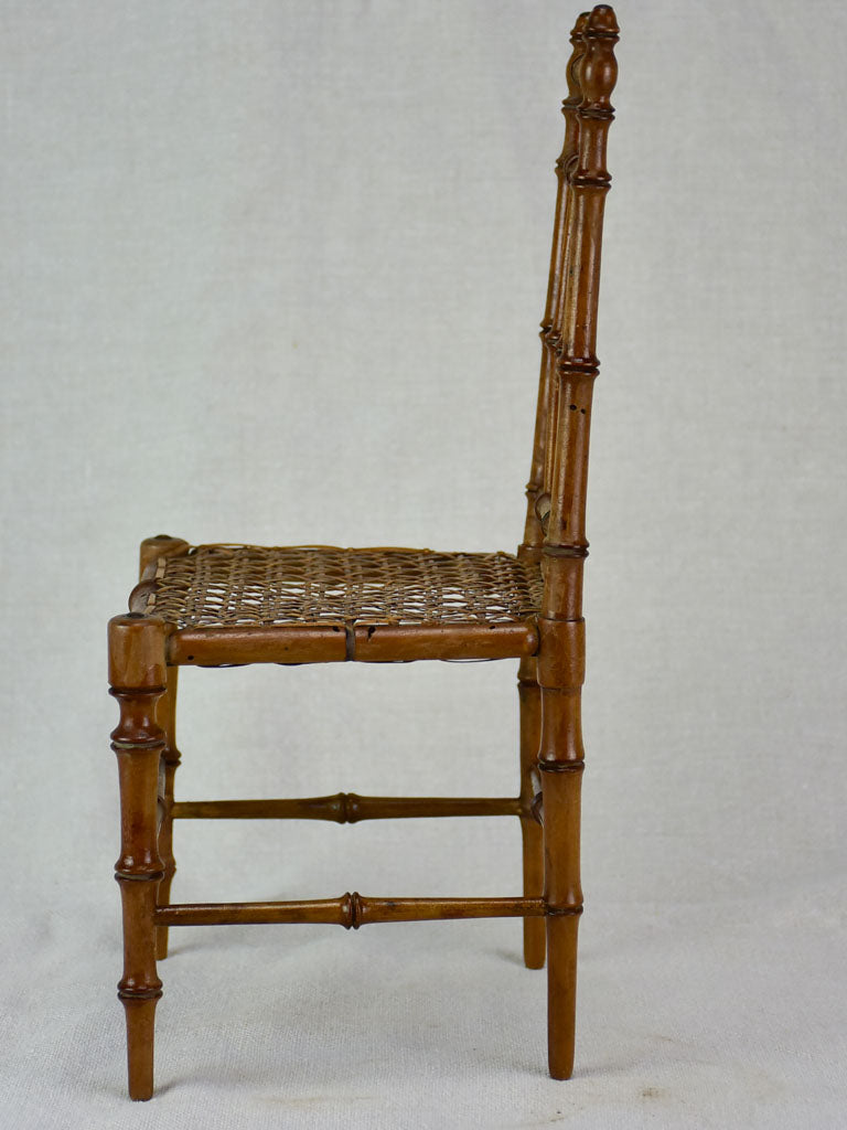 Miniature antique French chair with bamboo frame and cane seat