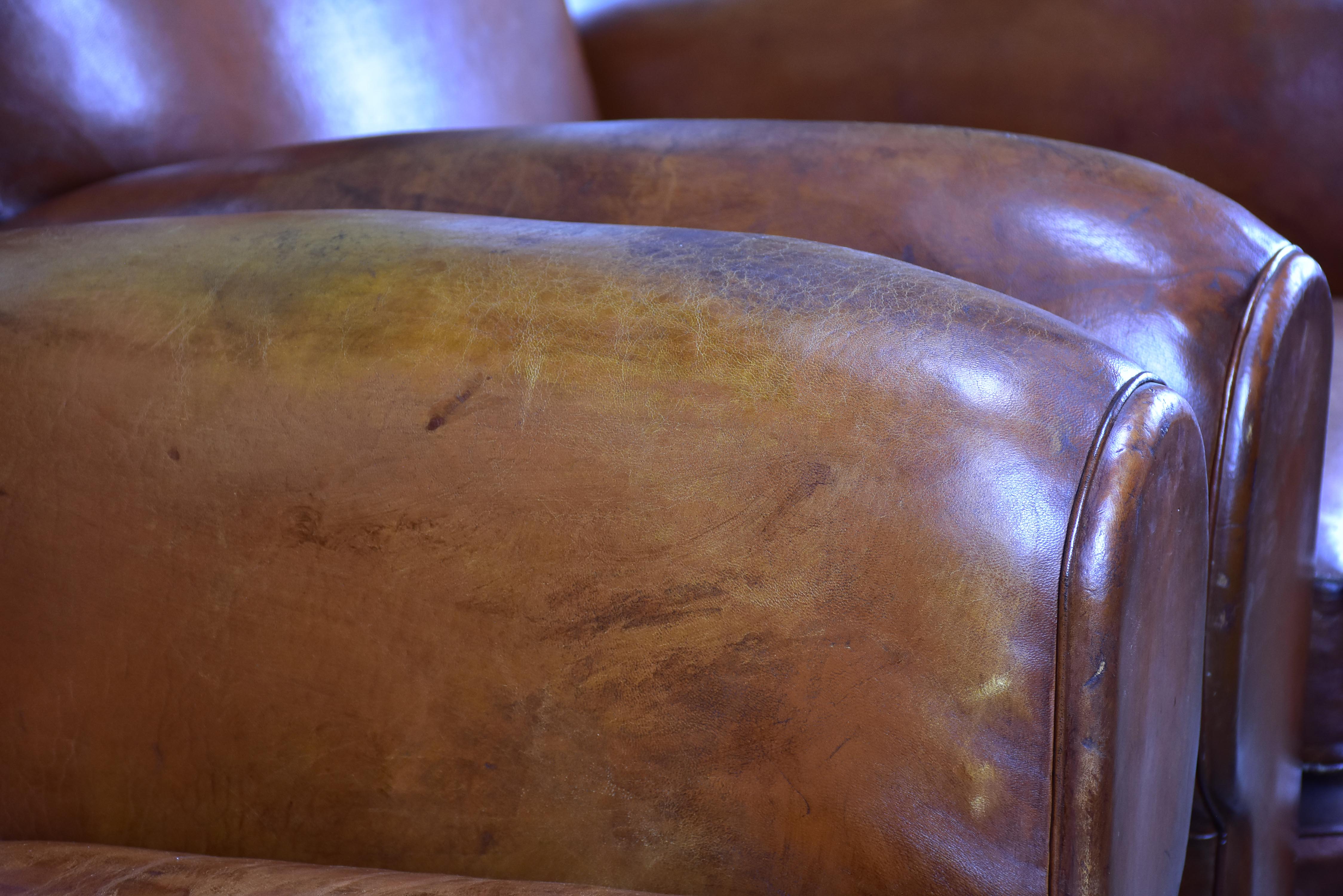 Pair of moustache back French leather club chairs