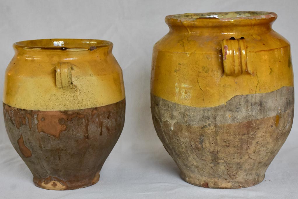 Two large antique French confit pots with yellow glaze