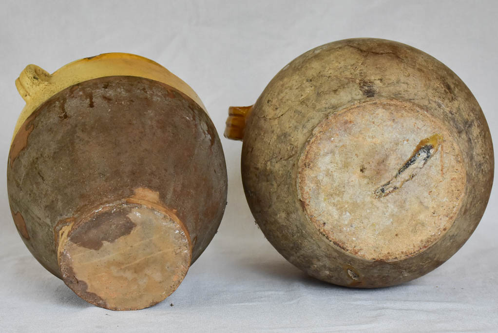 Two large antique French confit pots with yellow glaze