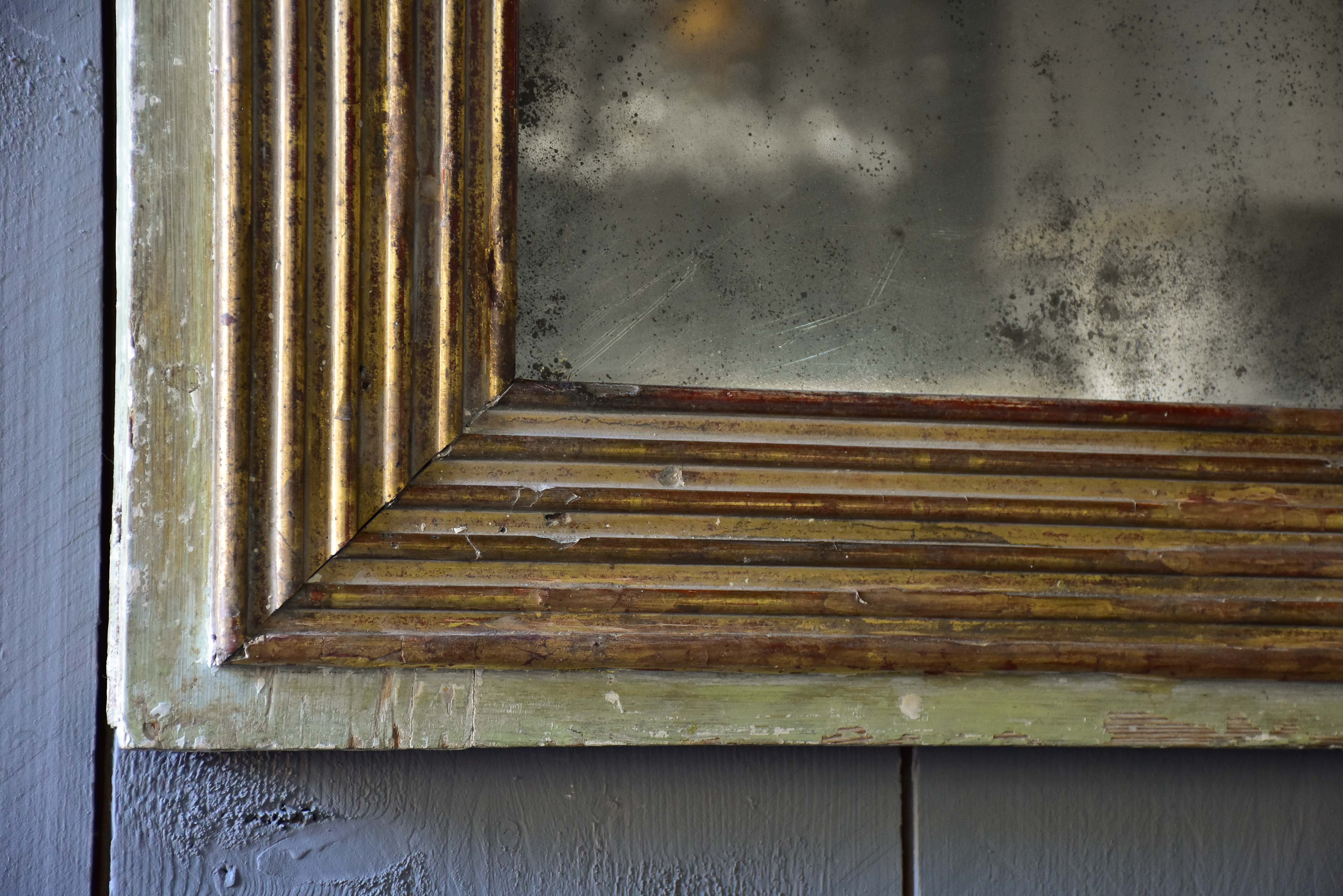 Late 18th century Louis XVI mirror with paneled glass