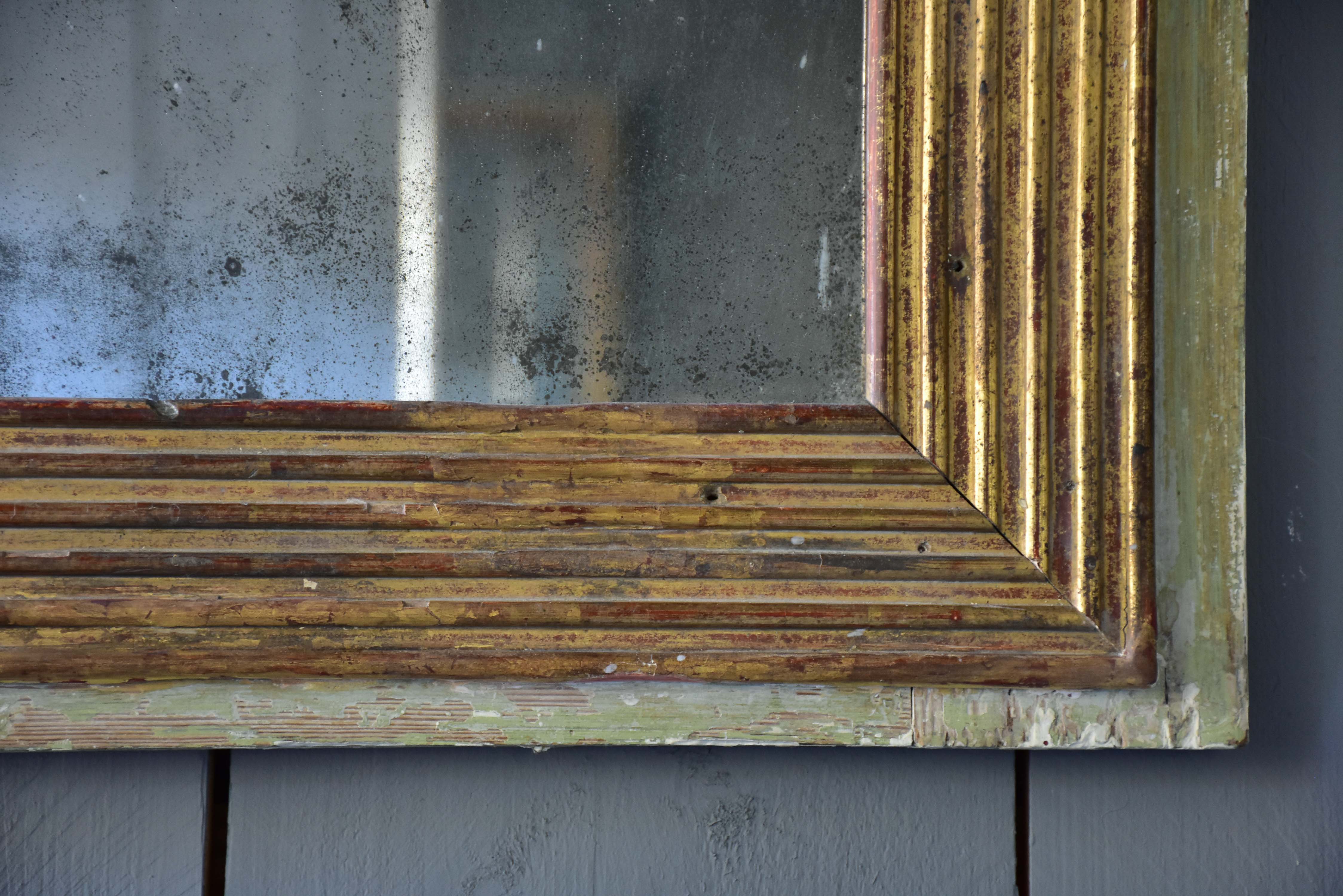 Late 18th century Louis XVI mirror with paneled glass