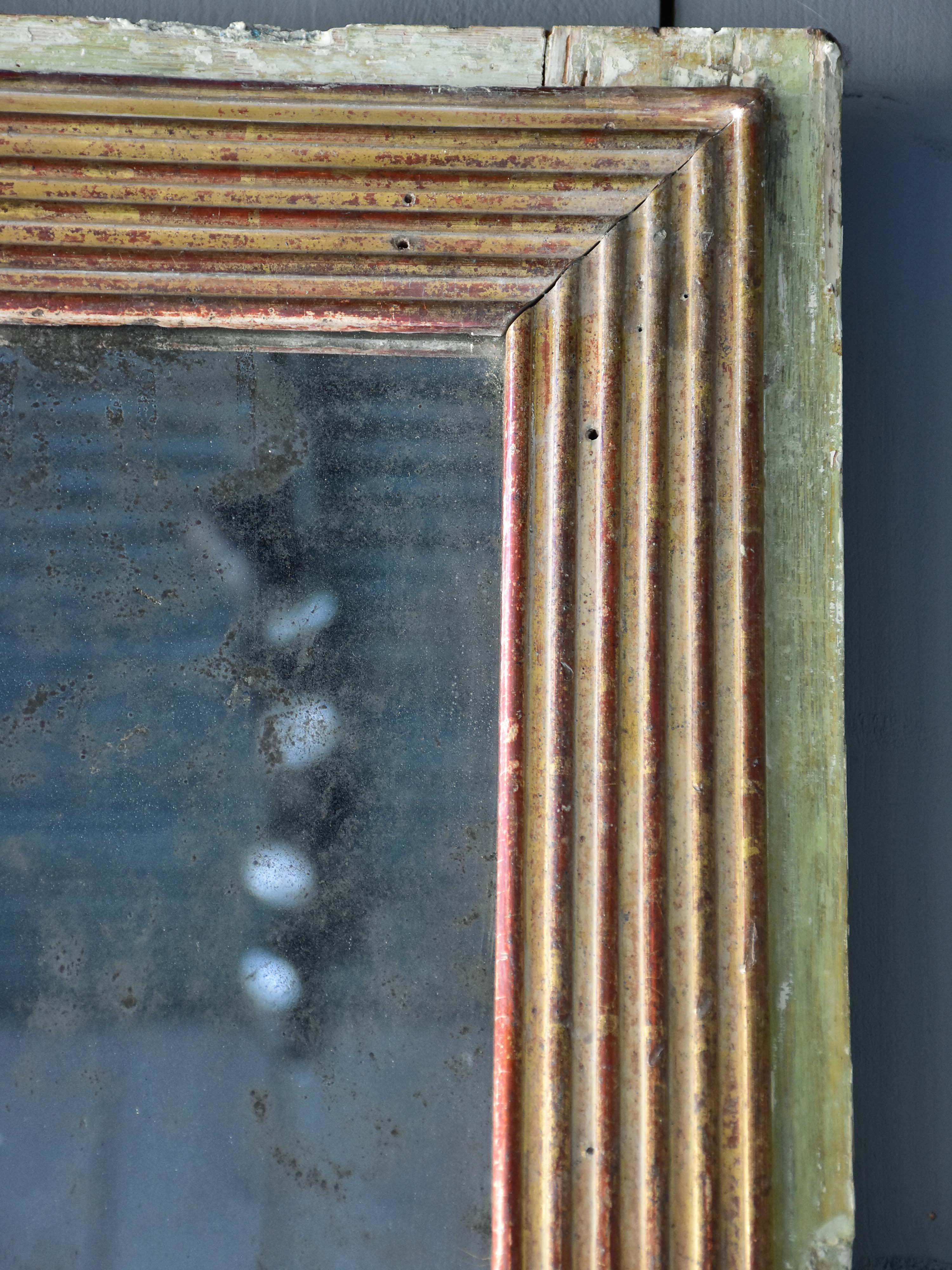 Late 18th century Louis XVI mirror with paneled glass
