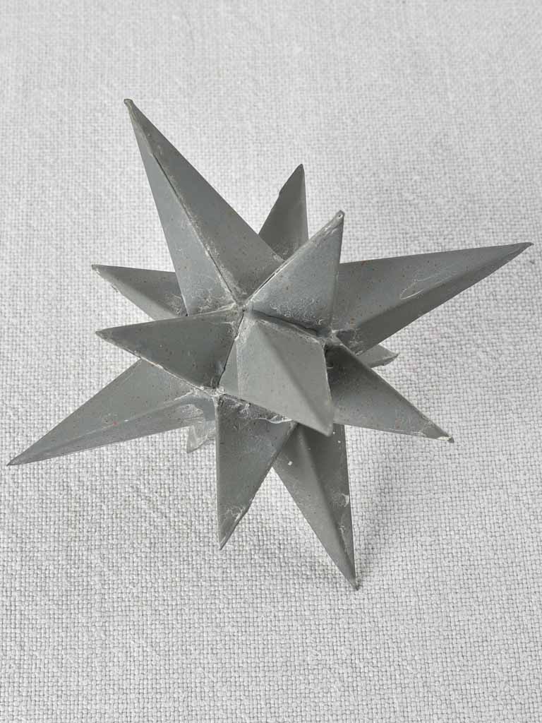 Collection of four early 20th century zinc stars 3½" - 10¼"