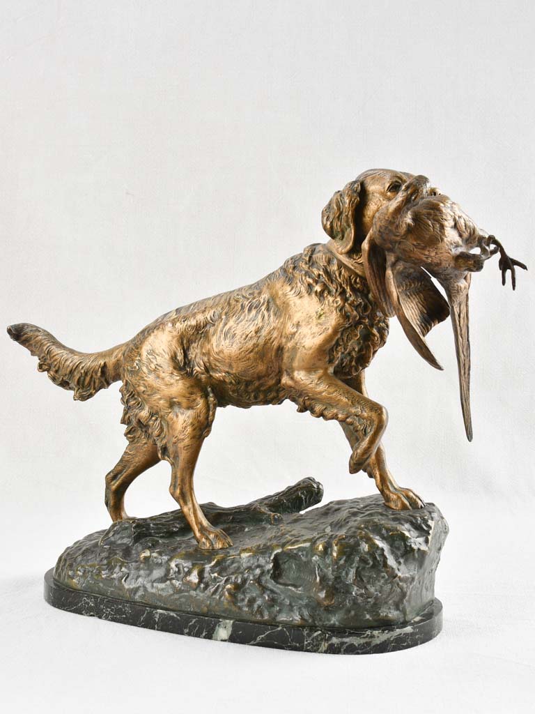Bronze sculpture of a hunting dog with bird in mouth - late nineteenth century 15¾"
