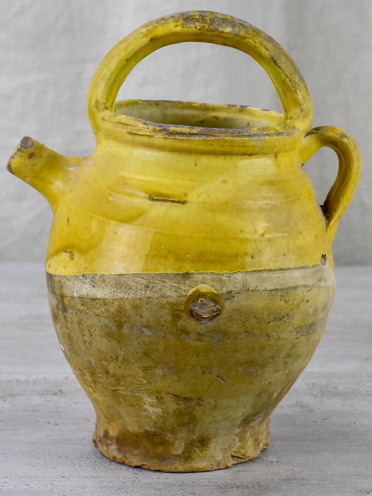 Late 19th Century French water pitcher with yellow glaze
