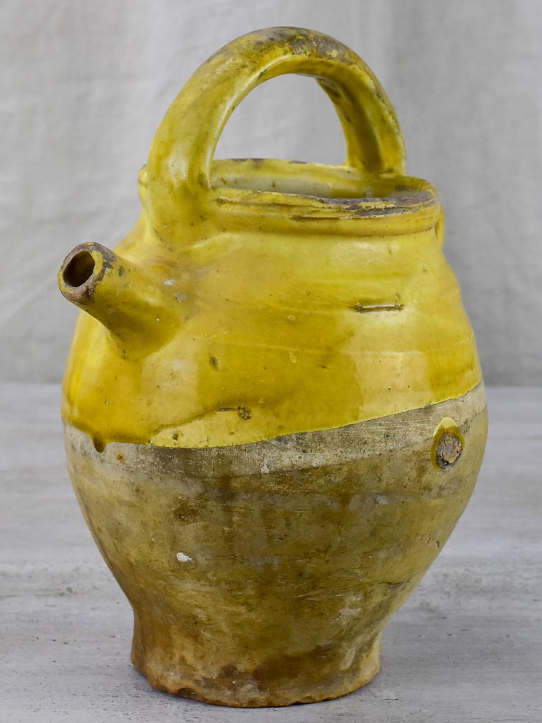 Late 19th Century French water pitcher with yellow glaze