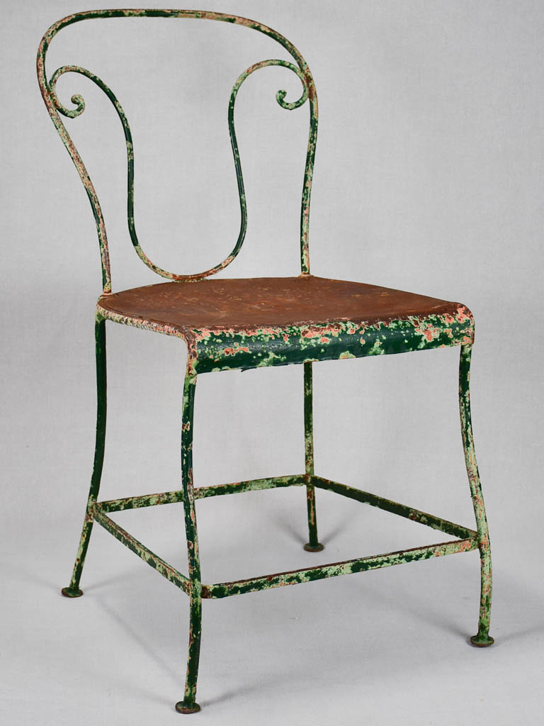 Pair of rustic French garden chairs with green patina