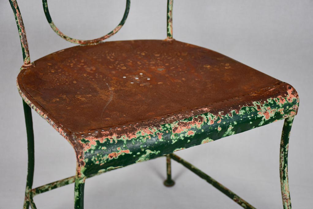 Pair of rustic French garden chairs with green patina