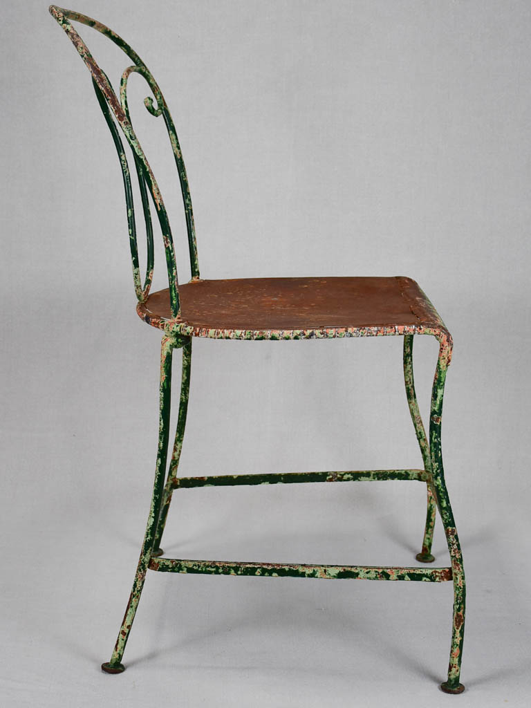 Pair of rustic French garden chairs with green patina