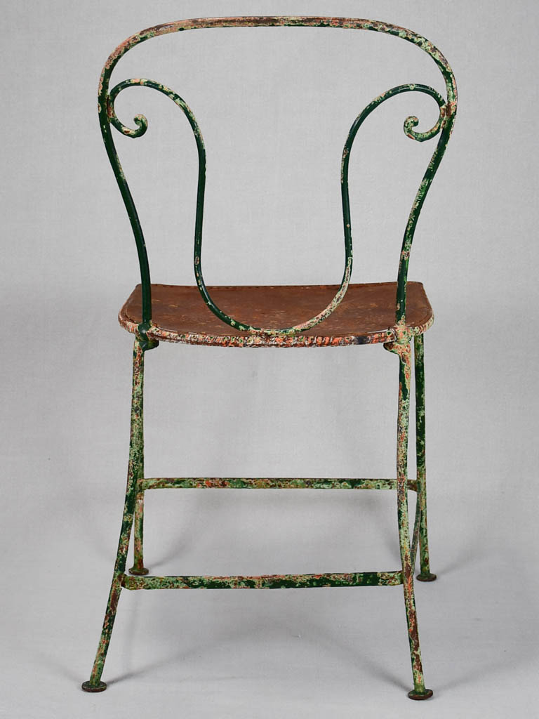 Pair of rustic French garden chairs with green patina