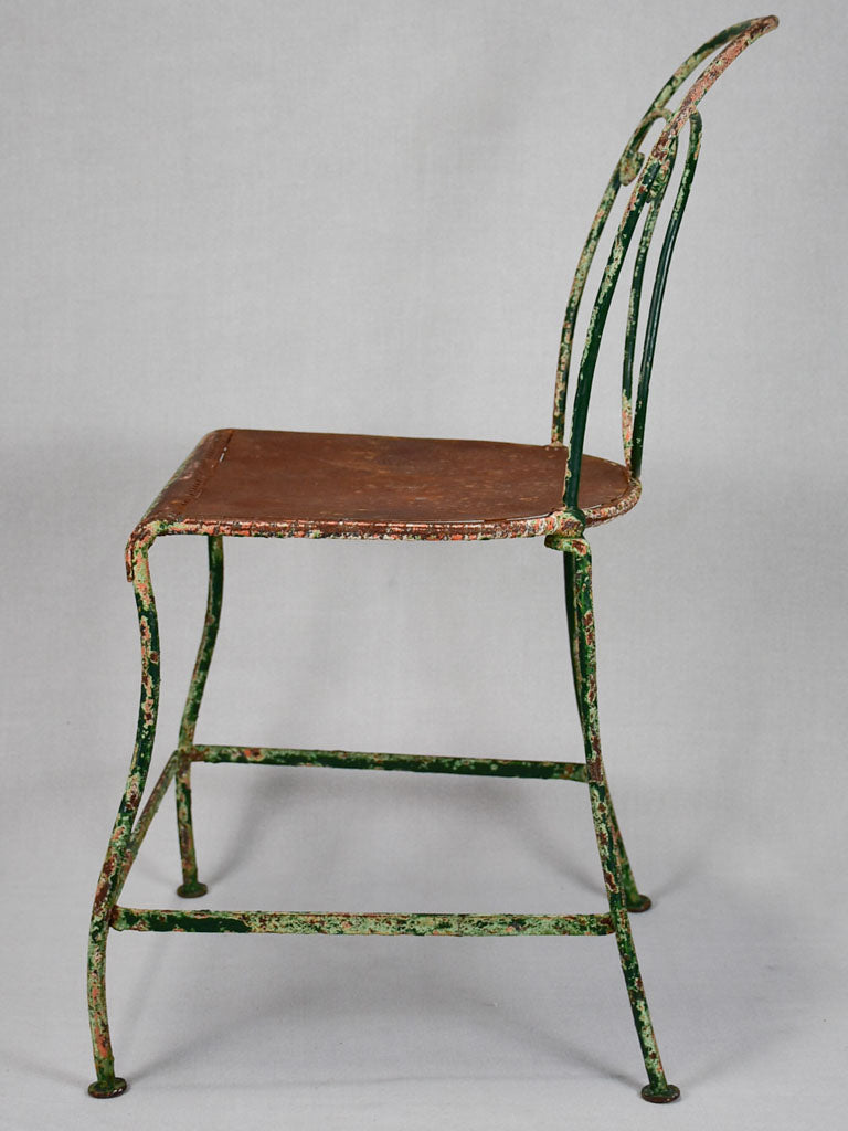 Pair of rustic French garden chairs with green patina