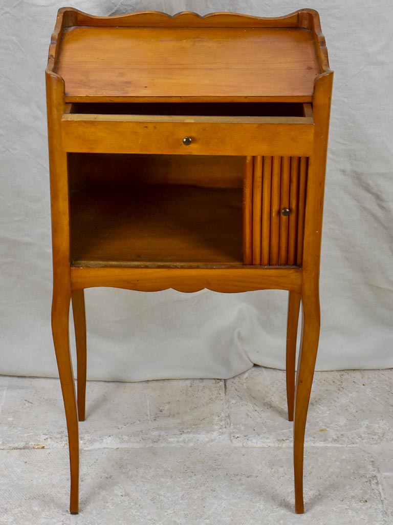 Mid century French nightstand in cherry wood with concertina door