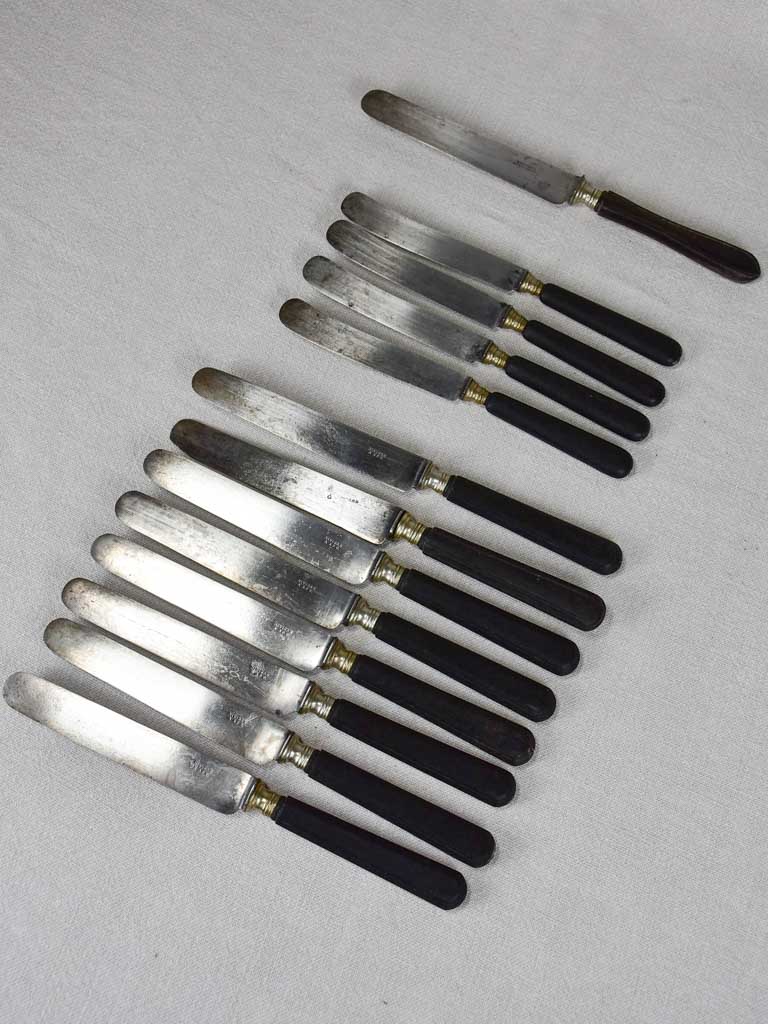 Collection of antique French knives with black handles
