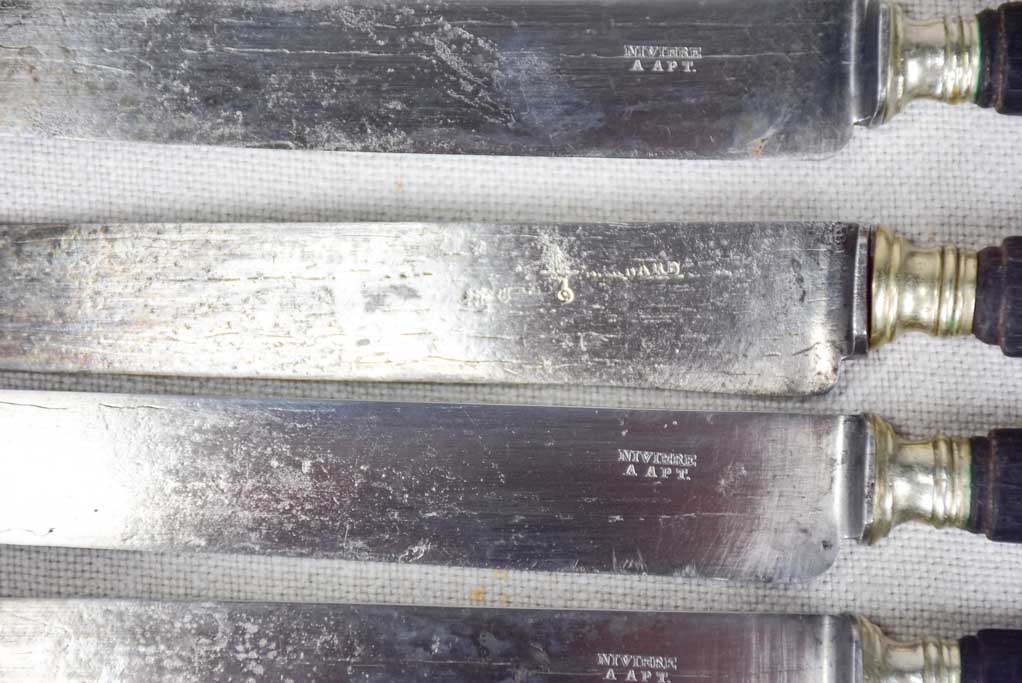 Collection of antique French knives with black handles