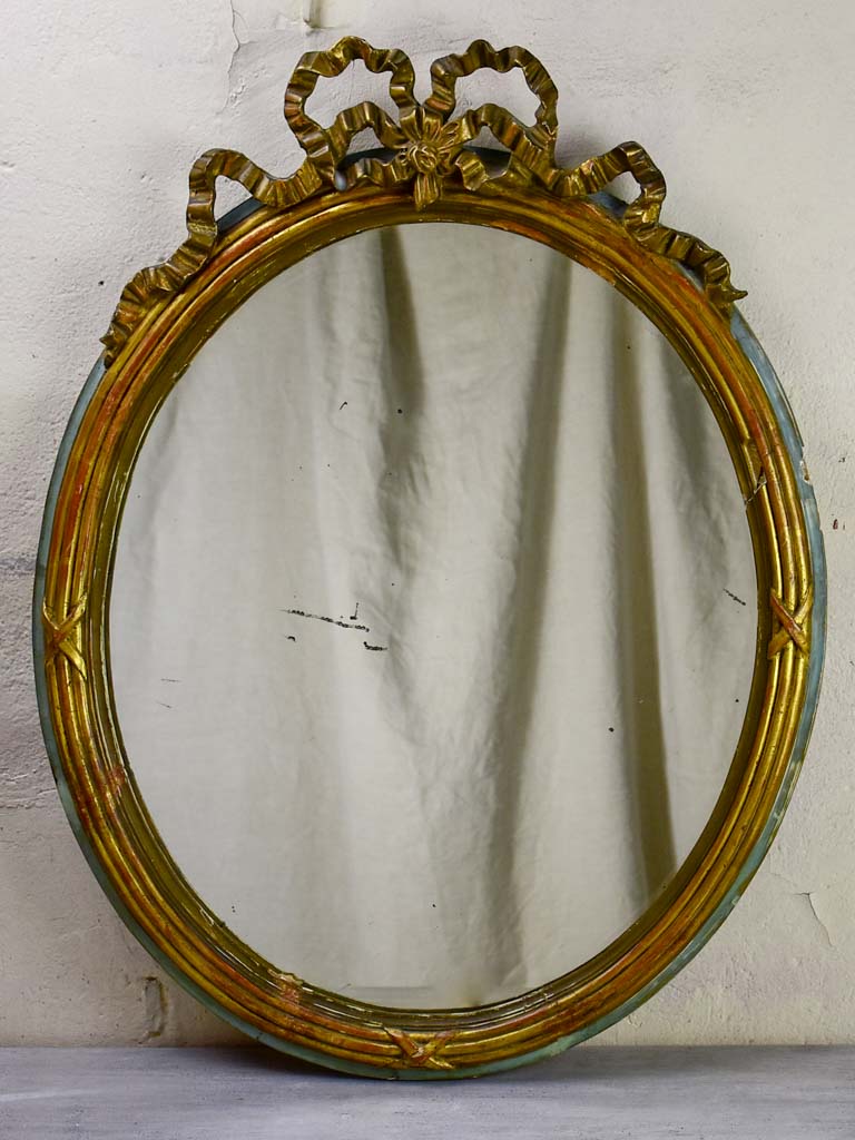 Oval Louis XVI mirror with bow 23¾" x 30"