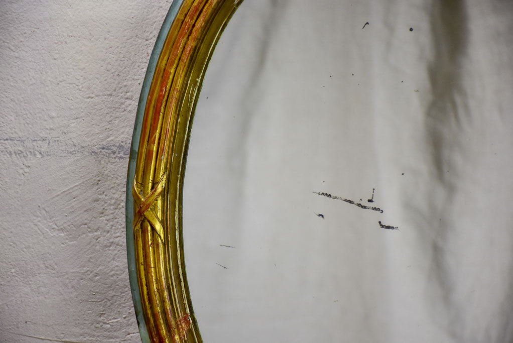 Oval Louis XVI mirror with bow 23¾" x 30"