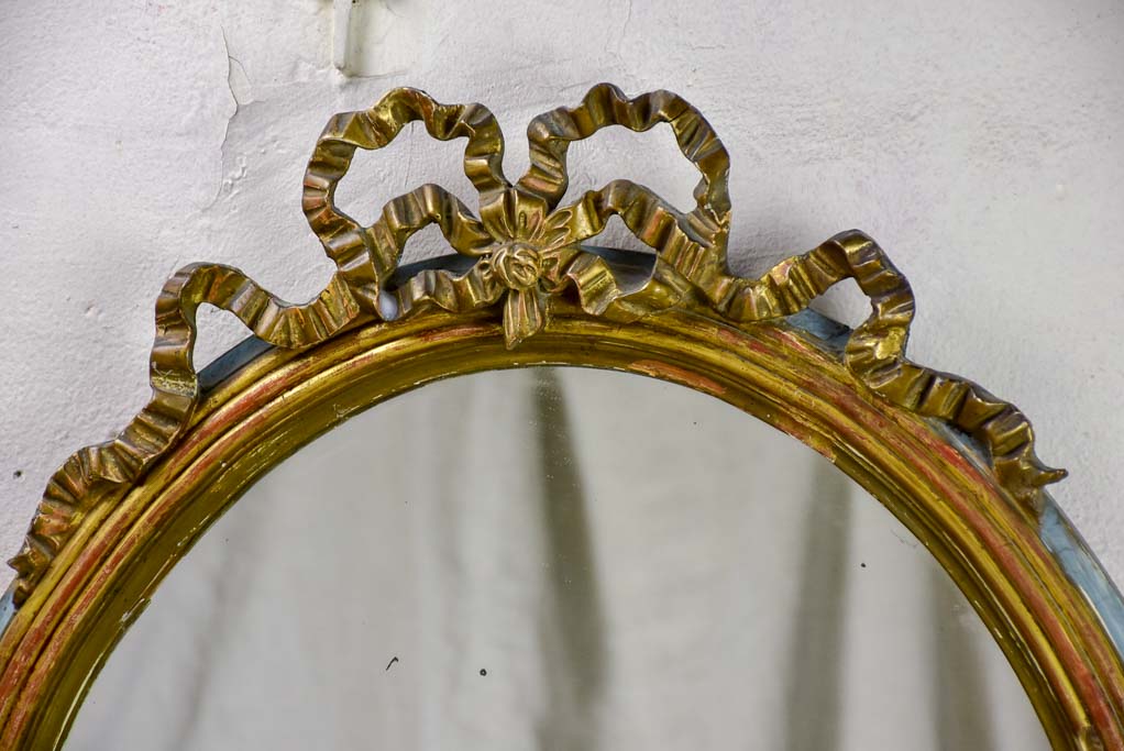 Oval Louis XVI mirror with bow 23¾" x 30"