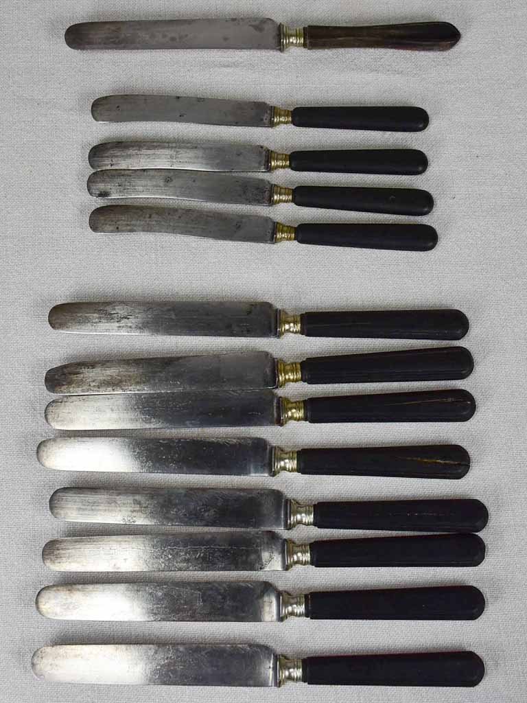 Collection of antique French knives with black handles