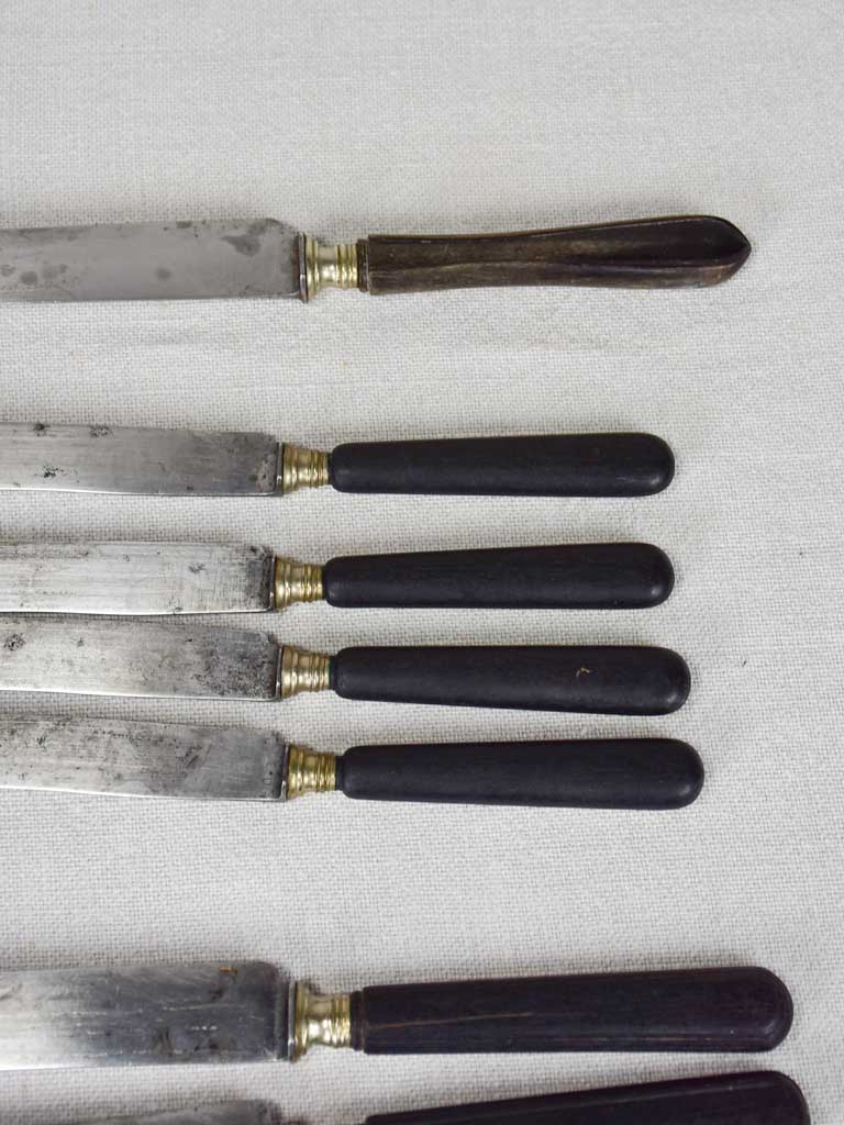 Collection of antique French knives with black handles