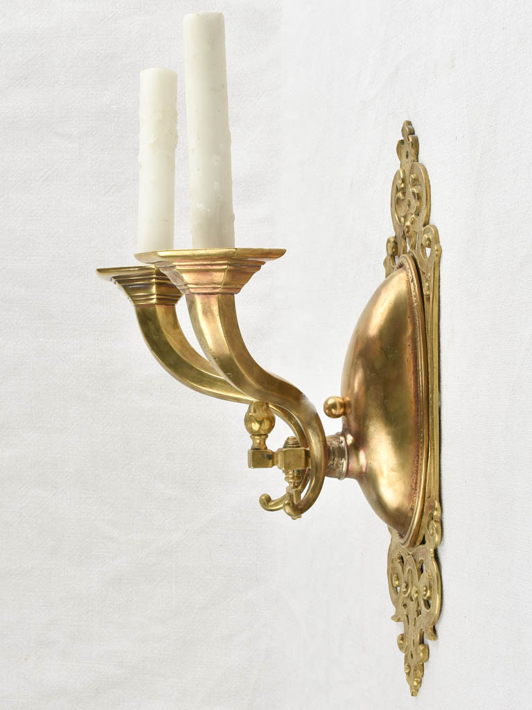 Aged bronze-finished two-light sconces