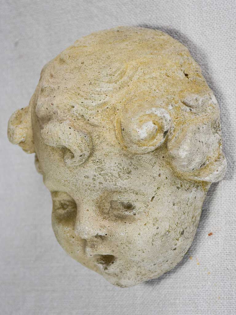 Stone sculpture of an angel's face from a fountain 5½"