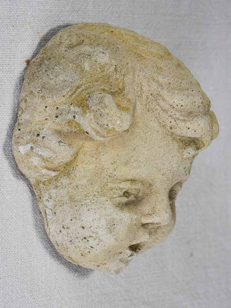 Stone sculpture of an angel's face from a fountain 5½"