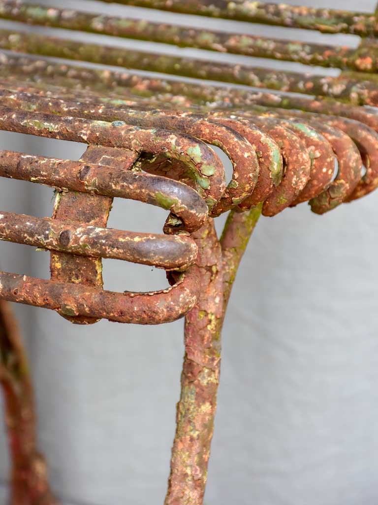 Pair of antique French Arras garden chairs with scrolled edges