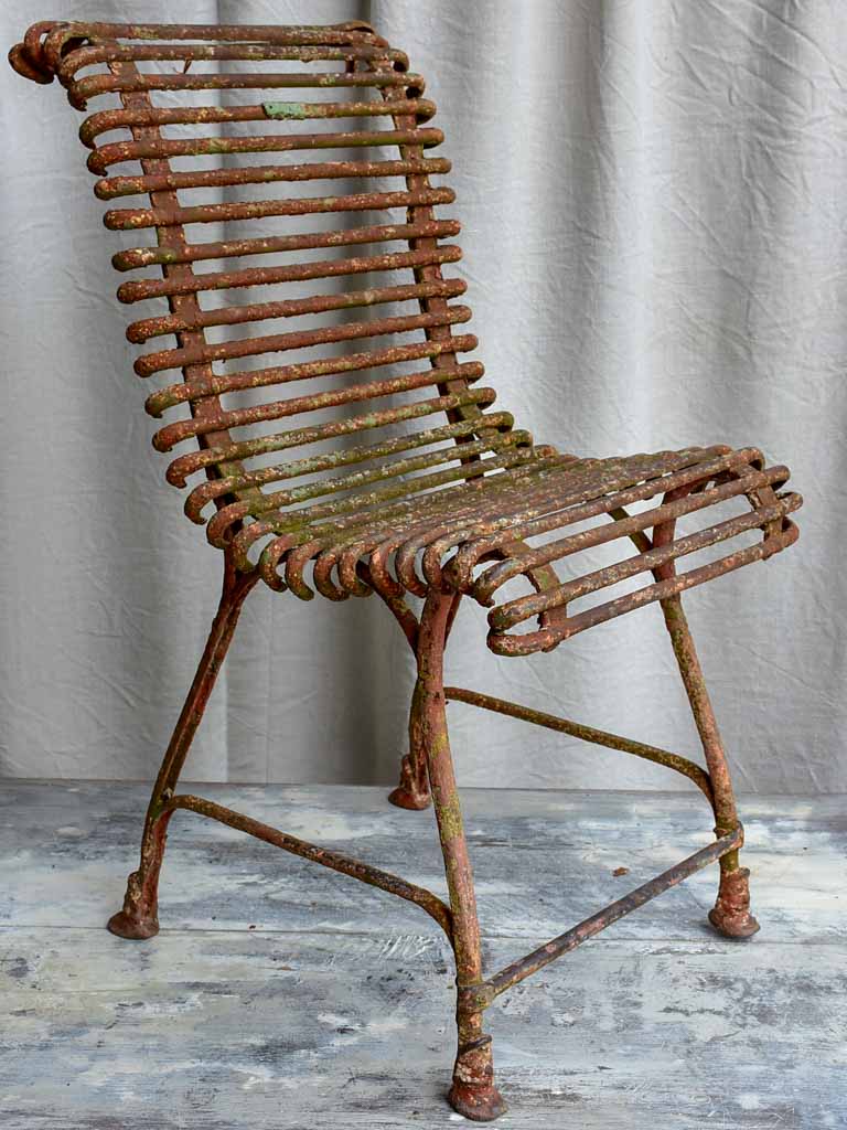 Pair of antique French Arras garden chairs with scrolled edges