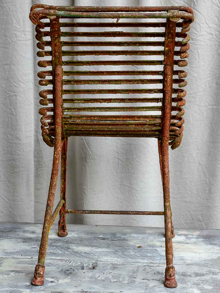 Pair of antique French Arras garden chairs with scrolled edges