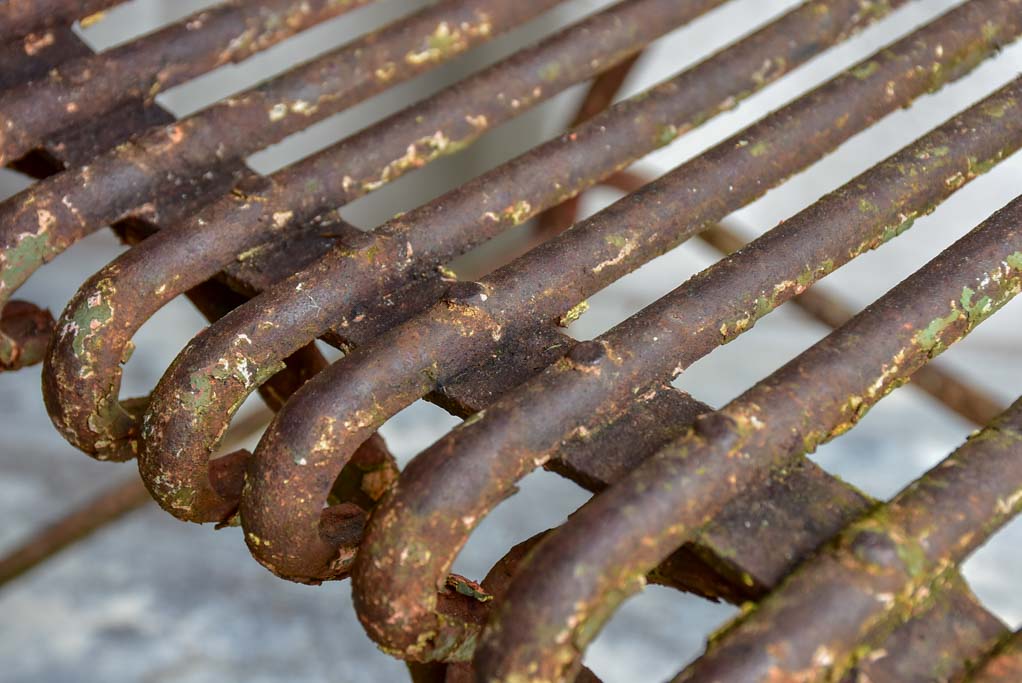 Pair of antique French Arras garden chairs with scrolled edges