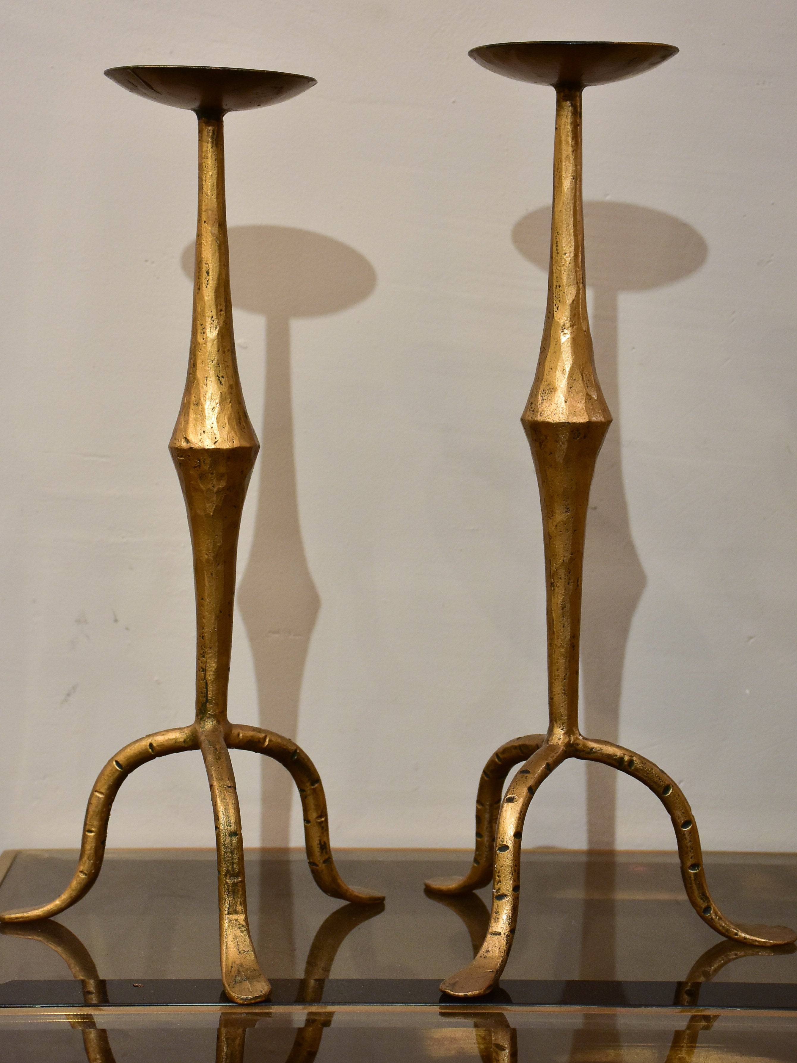 Pair of vintage gold candlesticks with a tripod stand