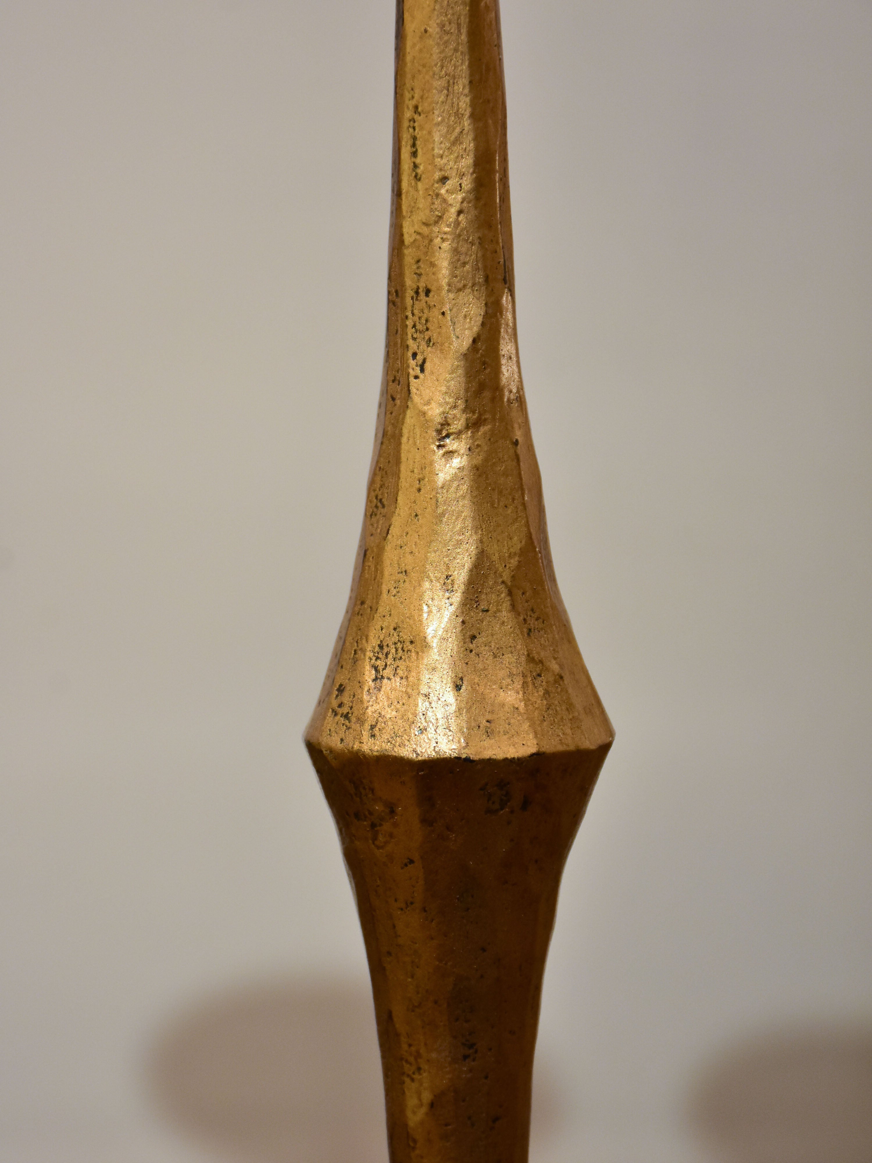 Pair of vintage gold candlesticks with a tripod stand