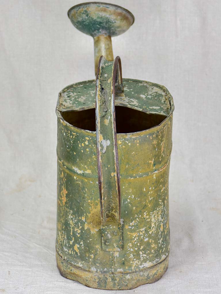 Antique French watering can with green patina
