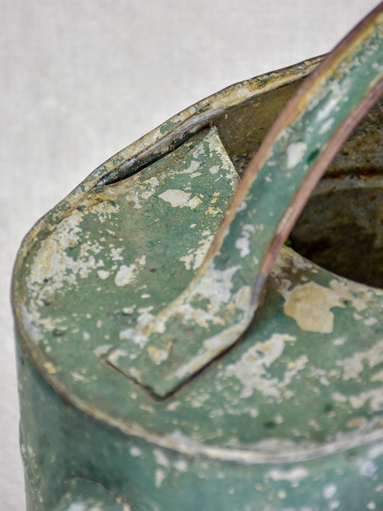 Antique French watering can with green patina