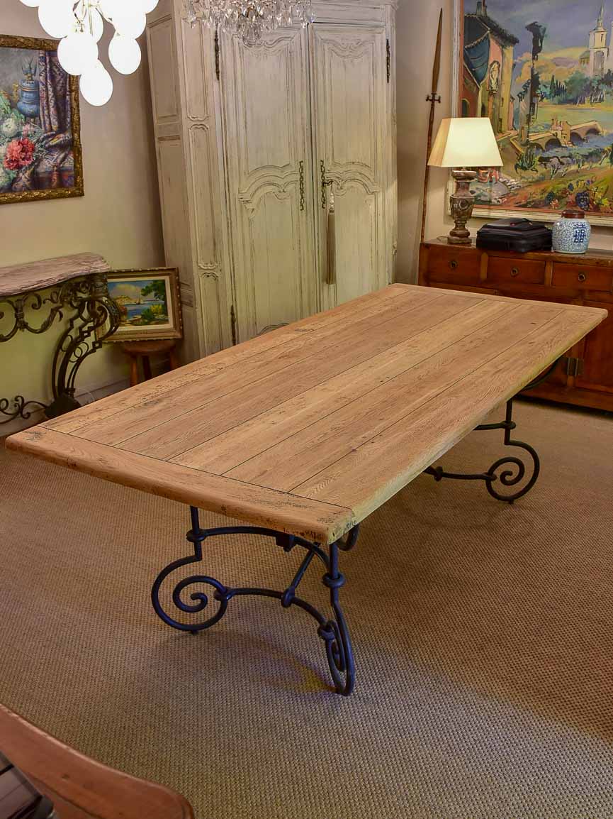 Antique French oak dining table with iron base