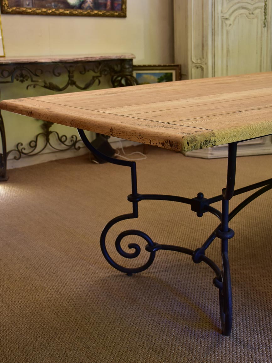 Antique French oak dining table with iron base